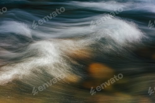 Preview: Long exposure abstract of flowing river water