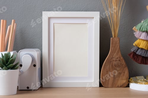 Preview: staionery stuff on working desk at home with photo frame