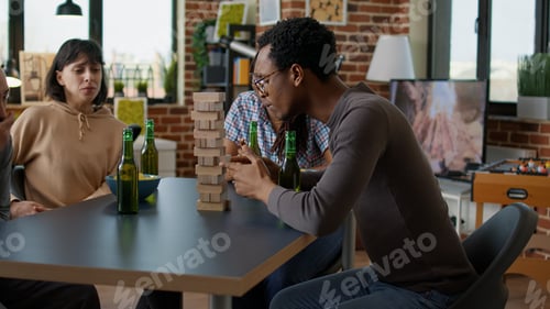Preview: Men and women gathering at home to play board game