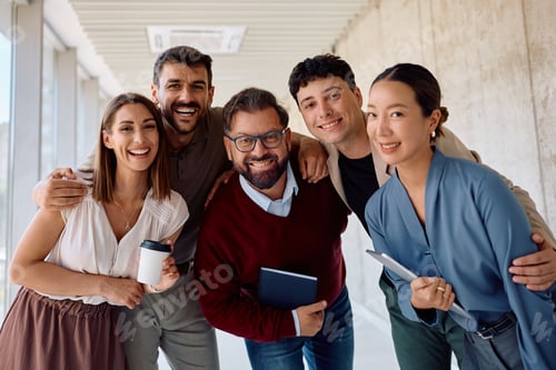 Preview: Happy diverse business colleagues in the office looking at camera.