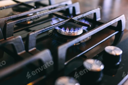 Preview: Gas flames burning on kitchen stove top