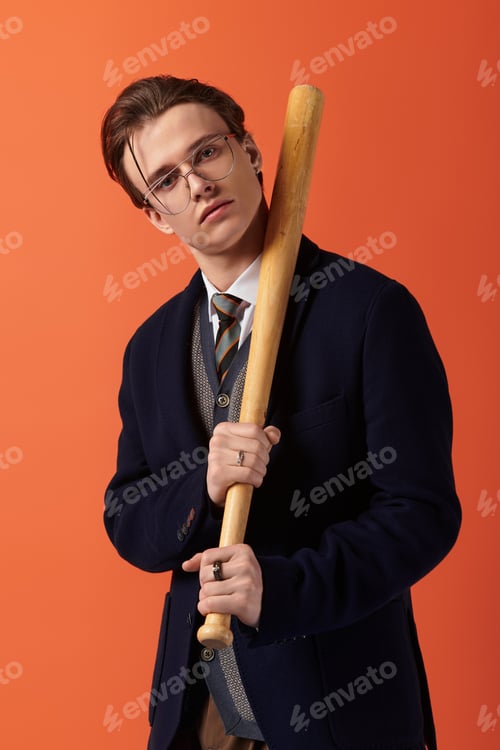 Preview: Stylish young man poses confidently with a baseball bat against a vibrant background