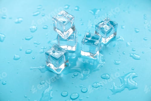 Preview: Concept of cold and refreshing. Ice cubes with water drops on a blue background.
