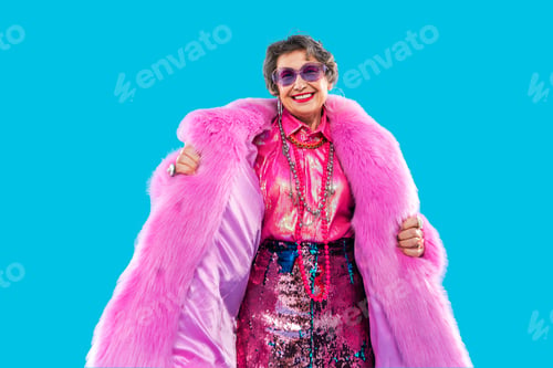 Preview: Happy and funny senior old woman on colorful background