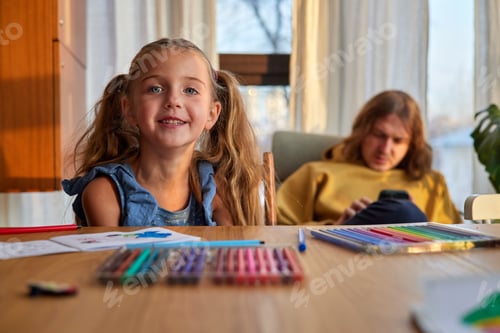 Preview: Girl takes markers from plastic box against man in room