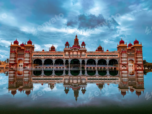 Preview: Beautiful Mysore palace of India under cloudy sky making mirror reflection in water