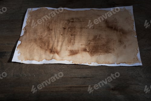 Preview: Sheet Of Paper With The Effect Of Aging On Dark Wooden Background.