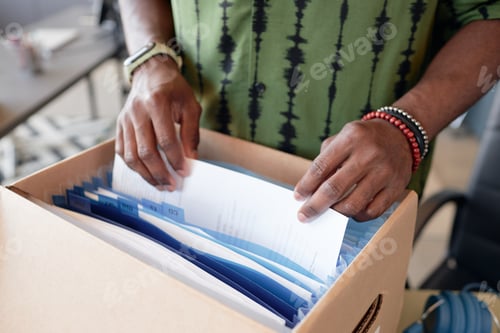 Preview: Close Up of Male Hands Sorting Documents in Folder Box