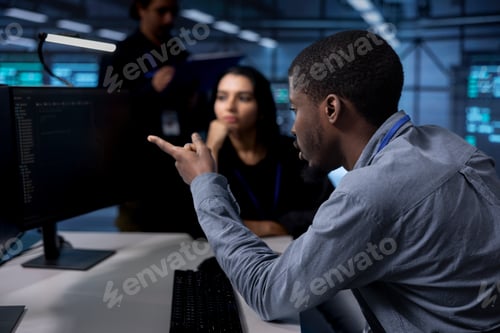 Preview: Coworkers collaborating to ensure data center equipment operates efficiently