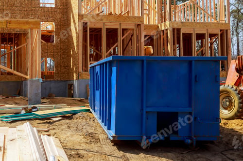 Preview: Old and used construction material in the new building frame of a new house under construction
