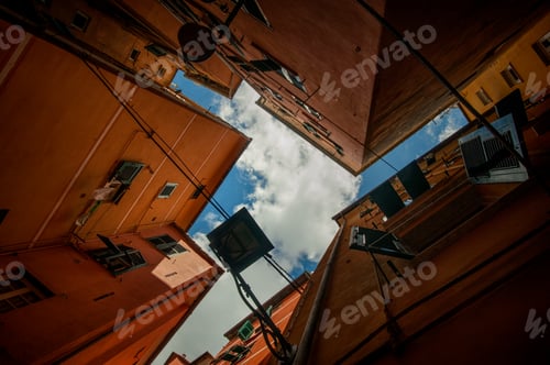 Preview: narrow, colorful streets, and courtyards, bottom view, geometry of facades, Liguria, Genoa, Italy