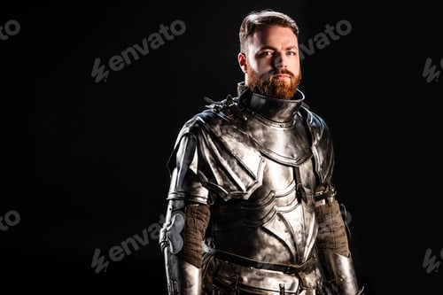Preview: handsome knight in armor looking at camera isolated on black