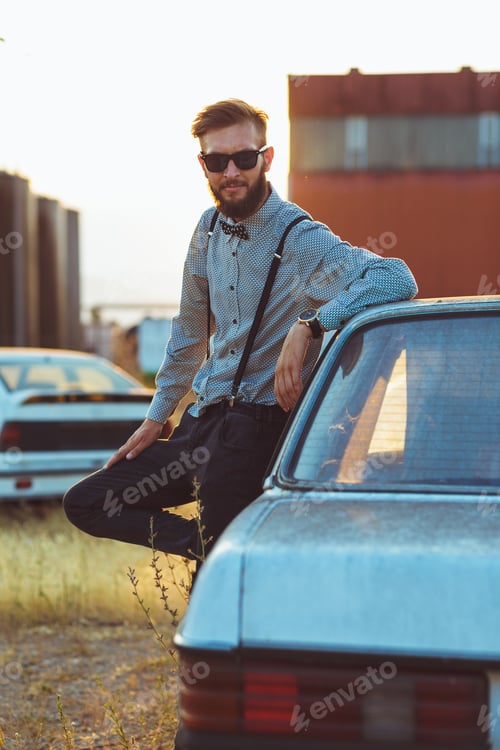 Preview: Young handsome stylish man, wearing shirt and bow-tie with old c
