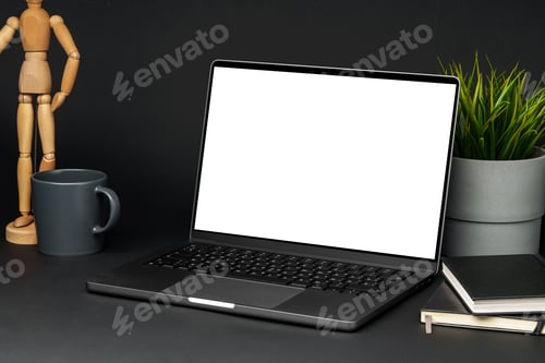 Preview: Open laptop with wooden mannequin on table against black background