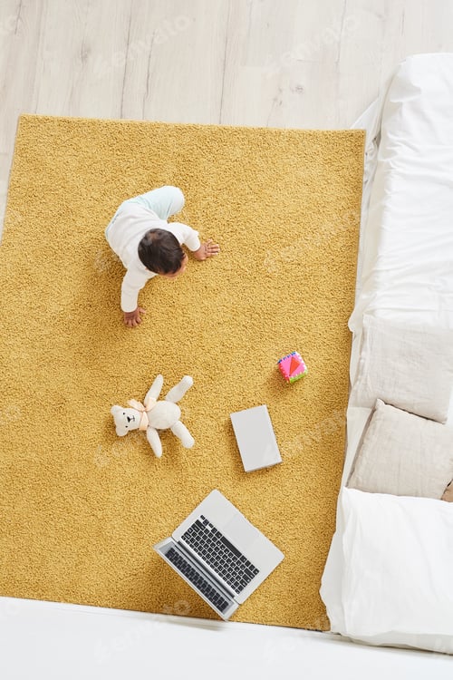 Preview: Child playing on the floor at home