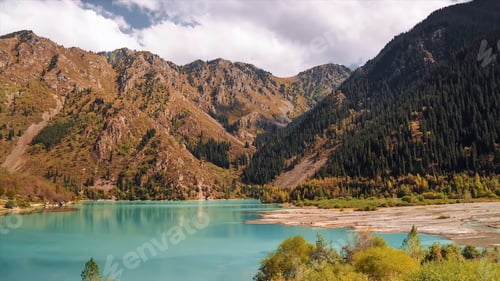 Preview: Idyllic summer landscape with clear mountain lake. Stock. Mountain lake landscape. View of the Sunny