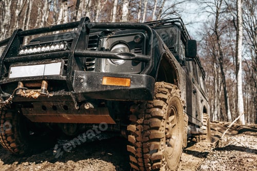 Preview: Dirty off road car on trip in forest