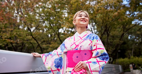 Preview: Woman, smile and walking with bridge, park and travel for journey and natural sustainability. Japan
