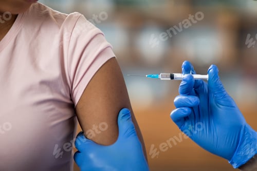 Preview: Nurse making injection for black woman patient, cropped