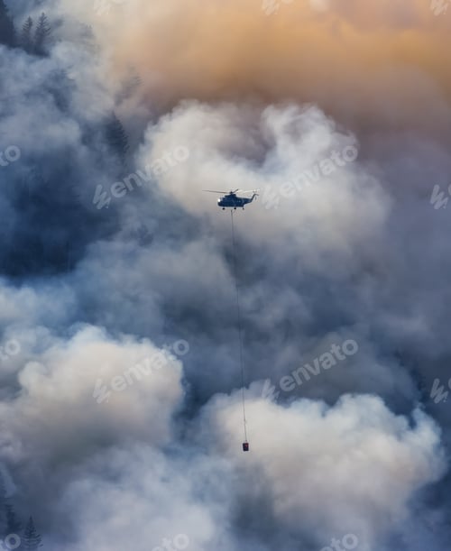 Preview: Wildfire Service Helicopter flying over BC Forest Fire and Smoke on the mountain near Hope