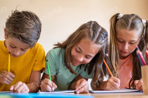 Preview: Children learning and writing, doing homework in class