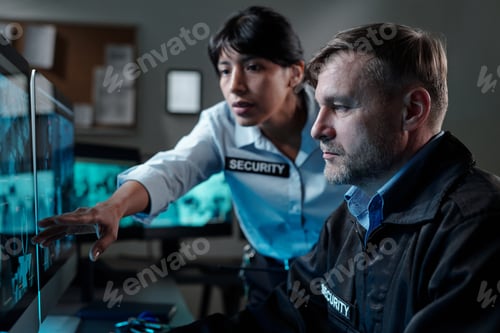 Preview: Mature guard looking at computer screen