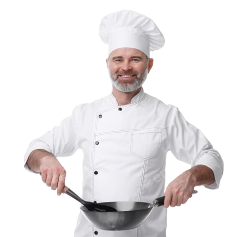 Preview: Happy chef in uniform holding wok and spatula on white background