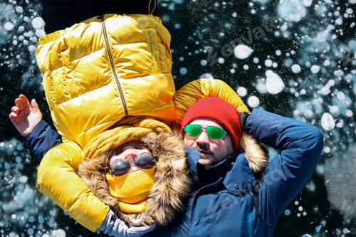 Preview: Happy couple on the frozen winter Lake Baikal