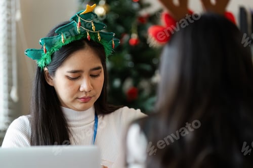 Preview: Festive Office Environment with Colleagues Celebrating Christmas in a Modern Workspace