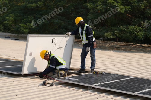Preview: Engineer installing solar cell panels on roof.