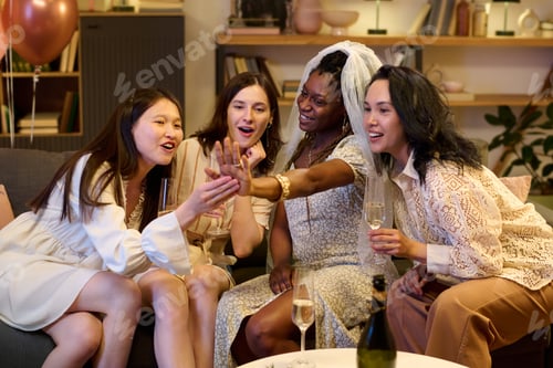 Preview: Diverse Young Women Celebrating Engagement and Bride Showing off Ring