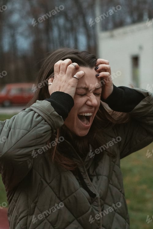 Preview: Screaming crying young woman on the street in twilight
