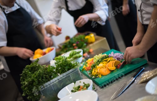 Preview: team cooks and chefs preparing meals