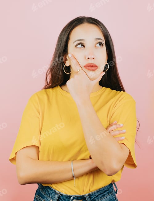 Preview: Young woman on yellow shirt thinking something and trying to find a solution