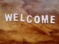 Preview: Welcome message on wooden background