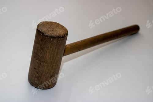 Preview: An Old Wooden Mallet Hammer On A White Background.