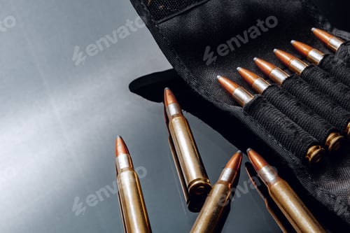 Preview: Rifle bullets or cartridges on black shiny background