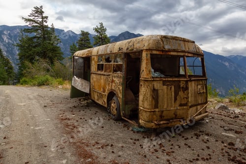 Preview: Old, Rusty, Broken and Abandoned Bus on a Dirt Road in the Mountain Valley