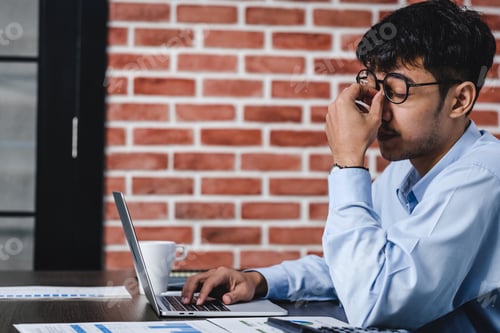 Preview: asian businessman get stress and headache when working with laptop