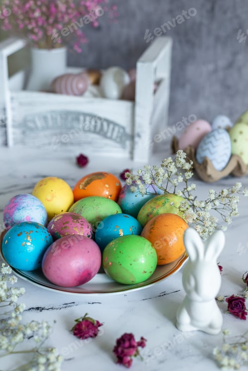 Preview: Easter celebration food still life, colorful painted eggs, Easter bunny bunny and flowers