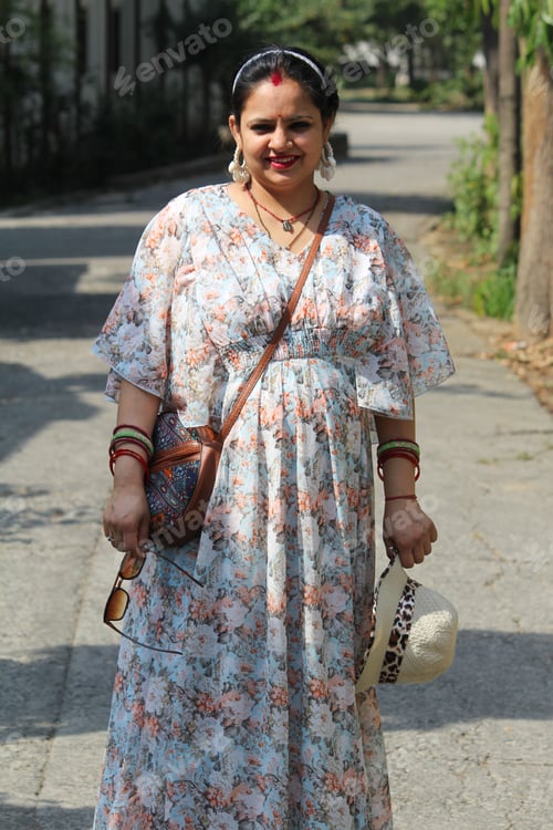 Preview: Woman in floral dress on street