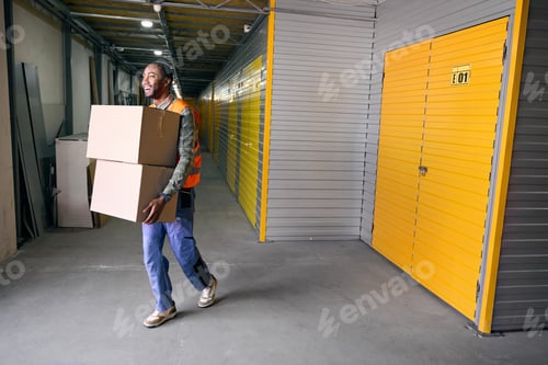 Preview: Joyful loader working in modern warehouse facility