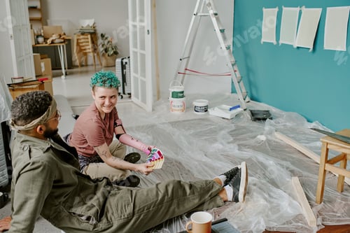 Preview: Young Couple Renovating Apartment and Choosing Paint Colors Together