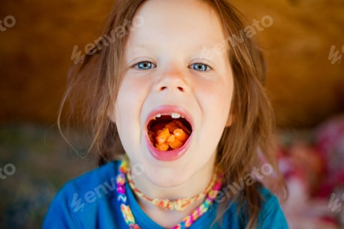 Preview: Little girl eats a carrot