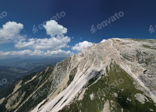 Preview: Mountain landscape with blue sky and clouds