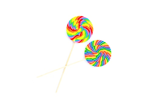 Preview: Rainbow lollipop on white background.
