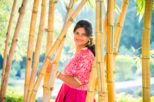 Preview: Happy smiling girl in bamboo forest.