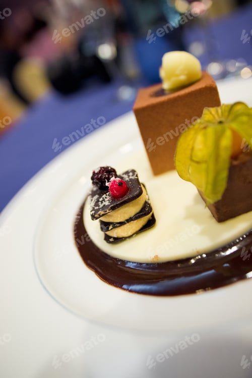 Preview: Desserts with fruits, biscuit mousse plated at a wedding.