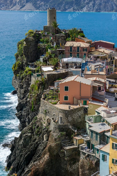 Preview: Scenic view of Monterosso al Mare beach with vibrant blue water and historic buildings in Italy