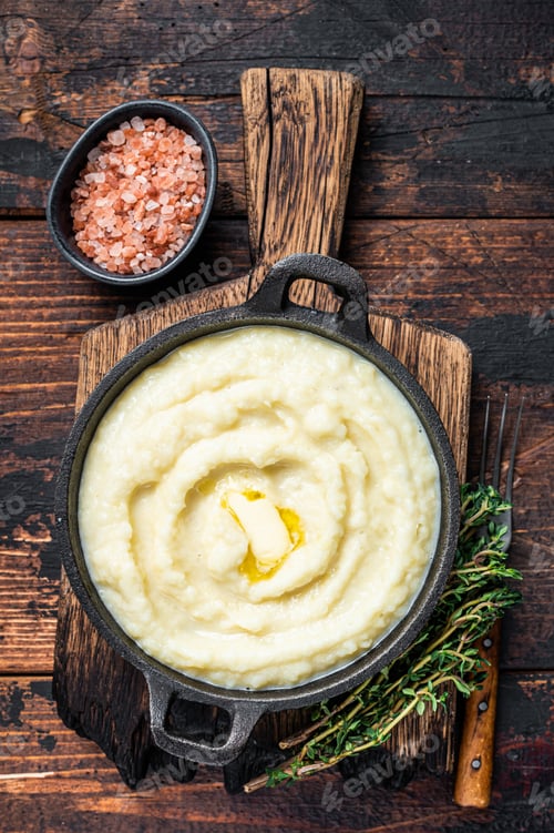 Preview: Mashed potatoes in a pan on wooden rustic table. Wooden background. Top view